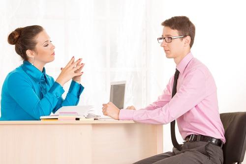 Man and woman &#8211; a job interview or business meeting. Male student came to the office to get a job. HR Manager conducts the first interview. Agree on. Discuss the possibilities of business cooperation. Photo courtesy of Shutterstock.
