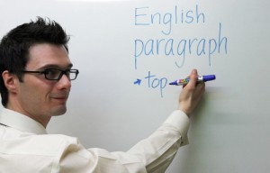English teacher at the board writing