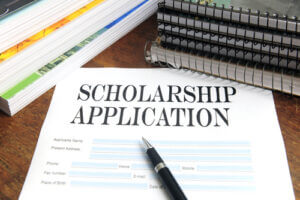 Scholarship application and books on a table