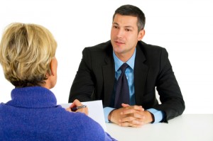 Man being interviewed by a woman