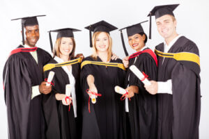 Group of college graduates with their degrees, certificates, or diplomas