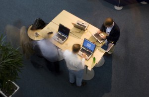 Overhead shot of executives working at a conference