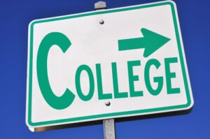 Sign with an arrow pointing in the direction of a college