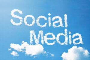 The phrase "Social Media" in cloud form in the sky