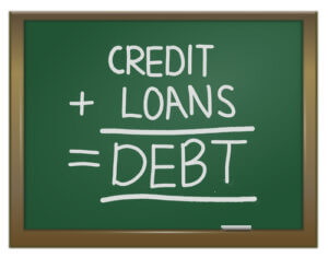 Chalkboard showing credit plus loans equal debt