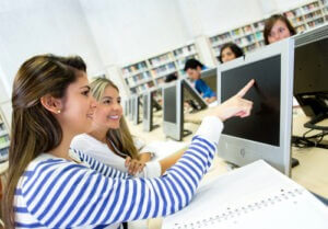 Women studying together in a computer lab