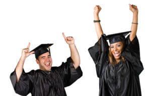 Two excited recent graduates in their caps and gowns