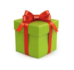 A green gift box with a red bow and ribbon