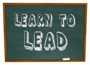 The words Learn to Lead on a chalkboard