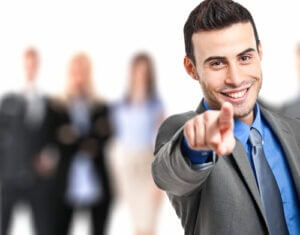 Young businessman pointing at you to join his team