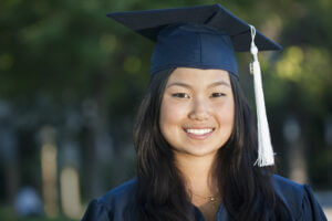 Young female graduate in cap and gown