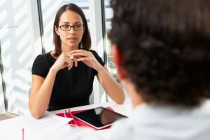 Businesswoman interviewing male candidate for a job