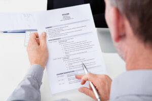Close up of person looking at a resume