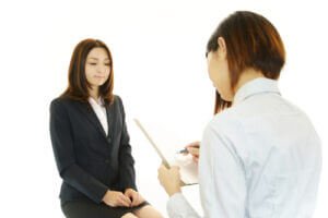 Female office worker interviewing prospective employee
