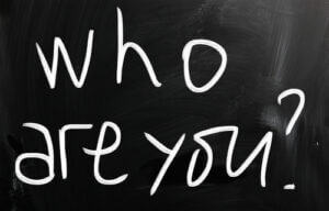 "Who are you" question written on chalkboard