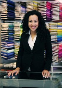 Happy female small business owner of a fabric store
