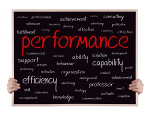 Performance written in red around other related words on a chalkboard