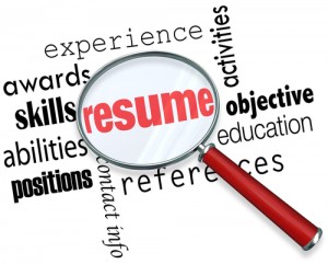 A magnifying glass over the word Resume surrounded by related terms
