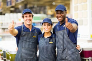 Group of hardware store workers giving thumbs up 