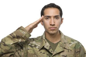 Soldier salutes on white background 