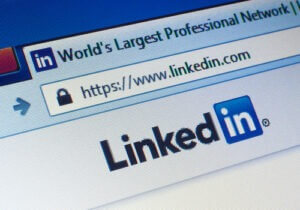 Linkedin.com homepage on the screen. LinkedIn is a business-oriented social networking service 