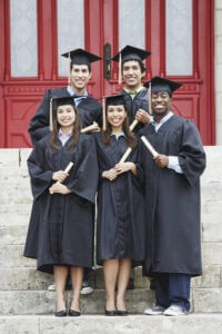 College graduates proudly holding diplomas 