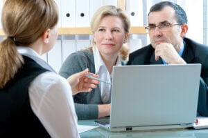 Mid-adult couple meeting with financial planner