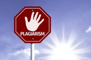 Stop Plagiarism red sign with sun background 