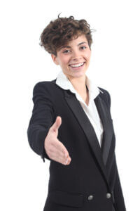 Beautiful businesswoman ready to handshake on a white isolated background