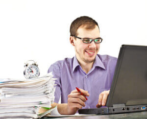 Male student happy about research results from the internet