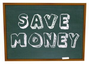 save money words on a chalkboard illustrating back to school savings or instructions on how to save on your education costs
