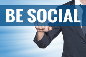 business man touching be social word on blue virtual screen