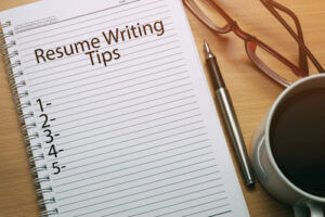 Resume writing tips written on notebook courtesy of Shutterstock.com