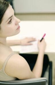 Woman writing photo by StockUnlimited.com